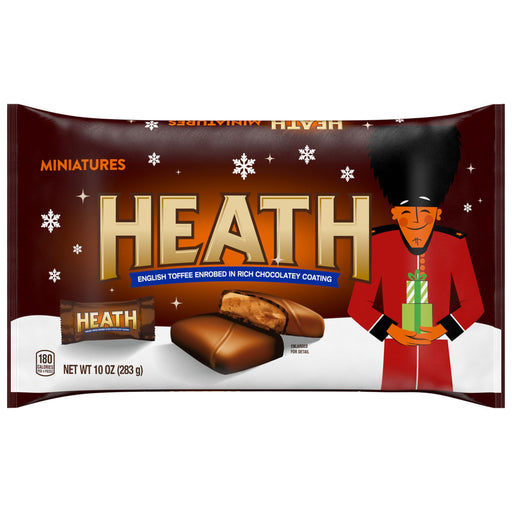 Heath chocolate candy package with a festive design featuring a person in a red coat and black hat holding a gift.