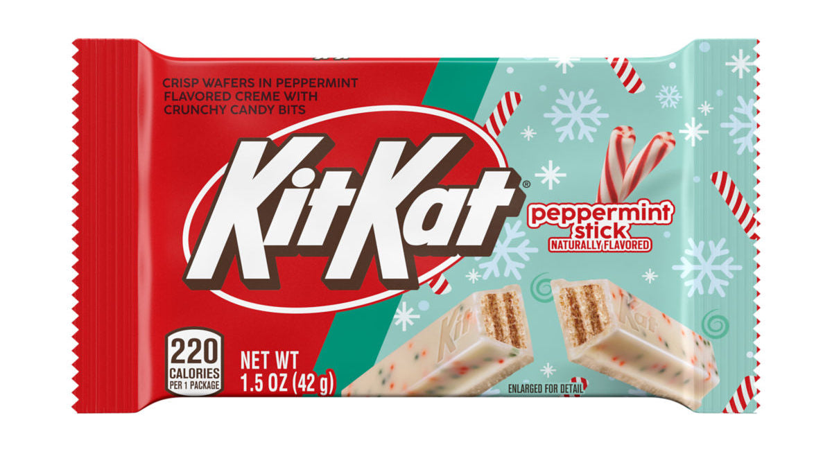 A package of Kit Kat Peppermint Stick natural-flavored wafers, featuring a red and mint green wrapper with white snowflake and candy cane graphics, and an image of the cream-filled wafers on the front.