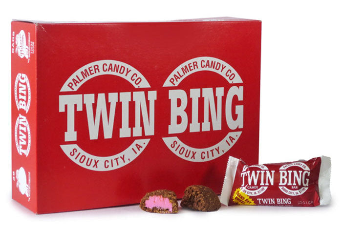 Twin Bing candy bar with two pieces cut open on a white background