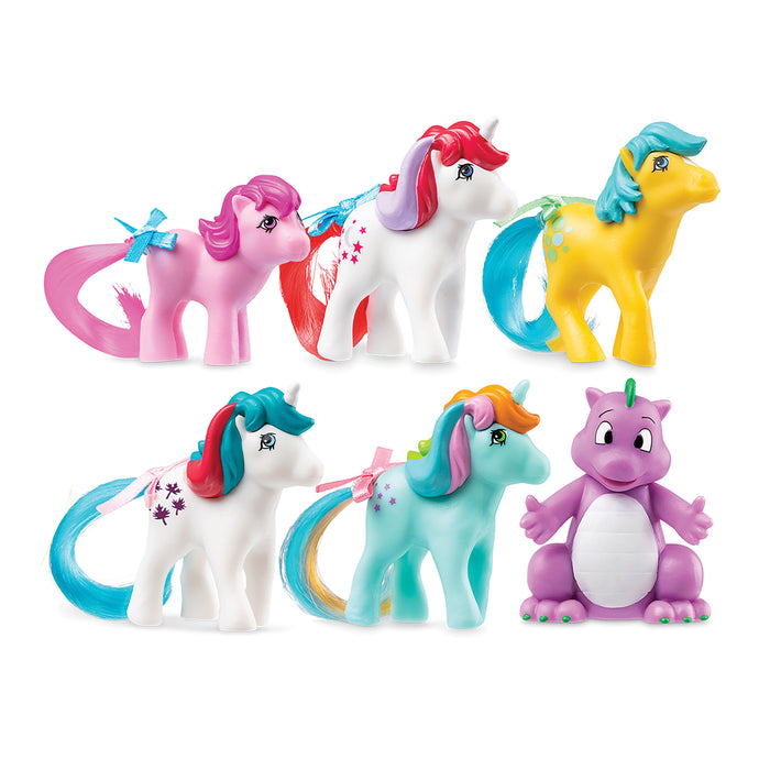 Set of colorful toy ponies on a white background