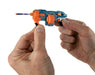 Hand holding a small blue and orange toy gun against a white background