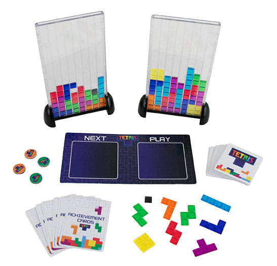 Tetris-themed board game set with pieces, cards, and display stands on a white background