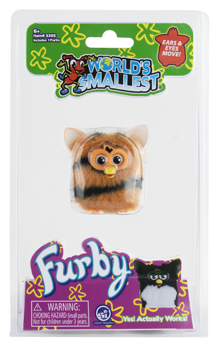 A packaged Furby toy from World's Smallest, featuring a small brown furry character with large eyes and a yellow beak inside a clear blister pack on a printed retail card.