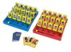 A board game set with two colored trays, one blue and one red, each holding yellow character cards with character portraits. Three face-up character cards are placed in front, and a blue deck of cards is visible on a plain white background.