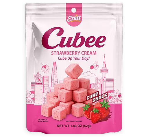 A package of Ezbee Cubee Strawberry Cream cube candy, shown in a white and pink resealable bag with illustrations of pink candy cubes, strawberries, and city silhouettes.