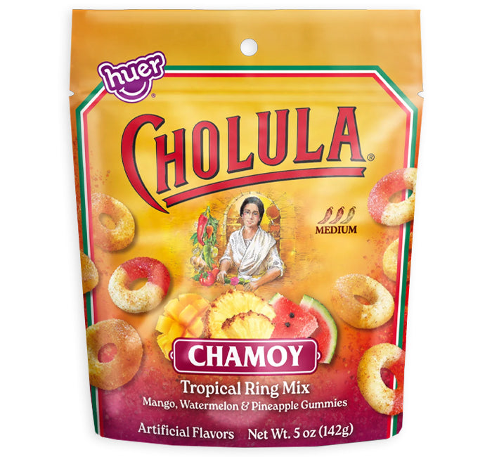 A 5 oz bag of Cholula Chamoy Tropical Ring Mix by Huer. The packaging is a vibrant yellow and orange pouch with red lettering and illustrations of the colorful ring-shaped gummies.