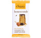 A packaged mini chocolate bar by chuao chocolatier, featuring a white wrapper with yellow-gold borders, honeycomb imagery, and text describing caramelized honey in dark chocolate.
