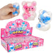 Squeeze toy with pink and blue bear design, displayed with packaging and a hand holding one of the toys.