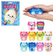 A set of cute, colorful squishy toy axolotls in various pastel and galaxy designs, shown alongside a person's hands holding one of the blue galaxy squishies and the retail packaging.