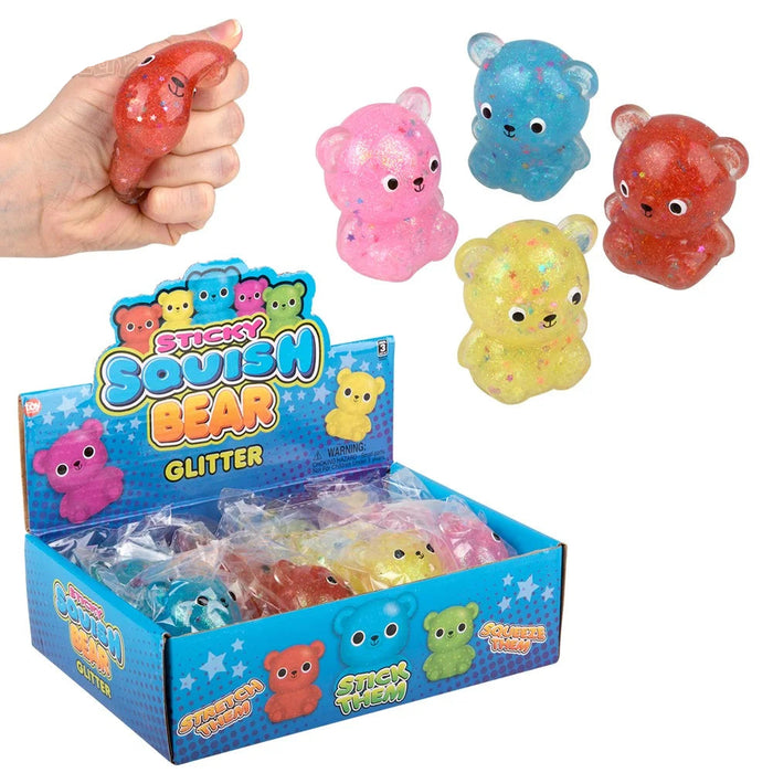 Colorful squishy bear toys with packaging and a hand squeezing one toy.