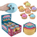 Squishy Stretch Dumplings sensory egg toy set shown with a hand holding a blue squishy, several open bento-style containers with colorful egg shapes, a retail display box, and a mystery color container on a white background.