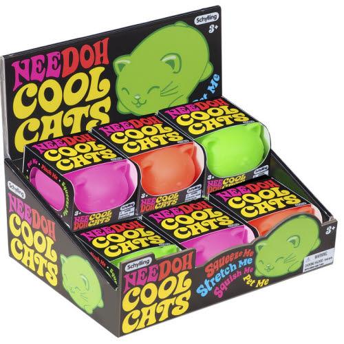 Display of Needoh Cool Cats toys in packaging with colorful text and cat illustrations.