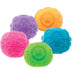 Five colorful scrubber balls with textured surfaces on a white background