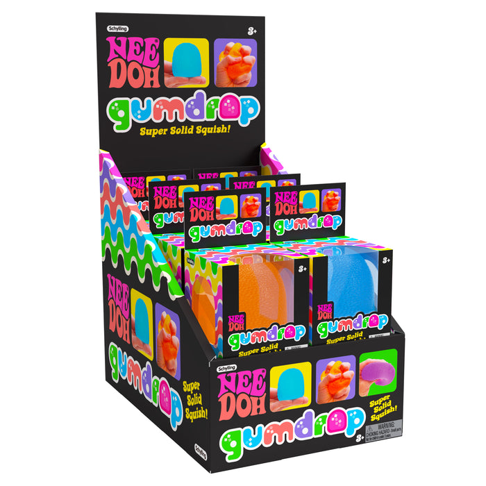 Display of Nee Doh Gumdrop toys in colorful packaging on a white background