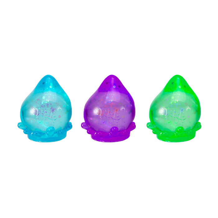 Three colorful droplet-shaped toys on a white background
