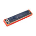 Red and metal harmonica on a white background