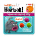 Squeeze popping kitty toy packaging with colorful hairballs and cartoon cat design.