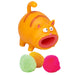 Toy cat with open mouth and colorful pom-poms on a white background