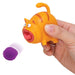 Hand holding a toy cat with a purple ball on a white background