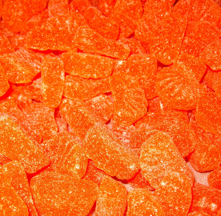 Indulge in the sweet and tart flavors of Zachary Confections' Bulk Orange Slices! Made with real fruit and a chewy texture, these jelly slices are a delicious treat that will transport you to the sunny beaches of Florida. Perfect for snacking or adding to desserts. Proudly made in the USA since 1950 from Frankfort, Indiana.