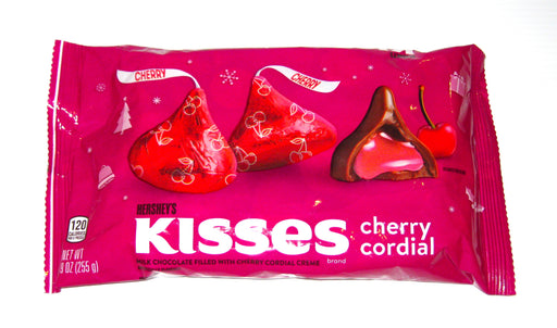 Indulge in the sweet and irresistible taste of Christmas Hershey Kisses Cherry Cordial. Each bite reveals a blend of creamy milk chocolate and a burst of cherry cordial filling, wrapped in festive red foil. Perfect for sharing with guests or as a delicious holiday treat.