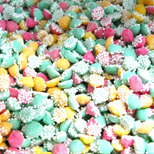 Colorful assorted candy mix including green, pink, yellow, and white pieces.