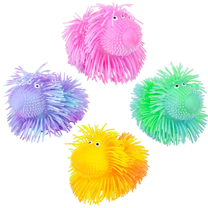 Set of colorful light up squishy puffer doggies
