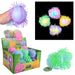 A multicolor glow-in-the-dark squishy puffer toy shown in a retail display box, with a hand holding one version, a close-up inset of several glowing balls, and one large green ball on a white background.