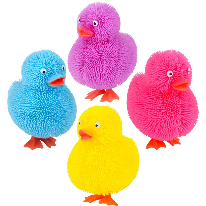 Four colorful fluffy ducks in blue, pink, yellow, and red on a white background