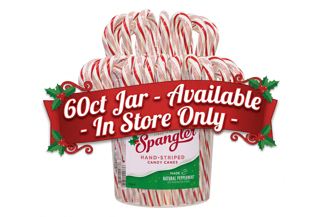 A clear plastic container filled with multiple hand-striped peppermint candy canes, with a visible Spangler label on the front, isolated on a white background.