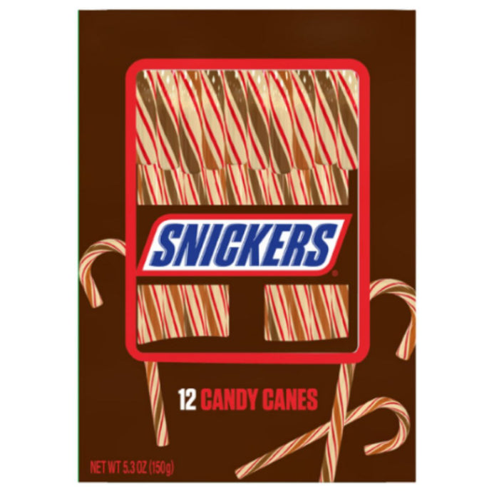 Snickers 12 Candy Canes packaging, featuring a brown background with illustrations of candy canes and a red-bordered window showing striped candy canes. The Snickers logo is prominent in the center.