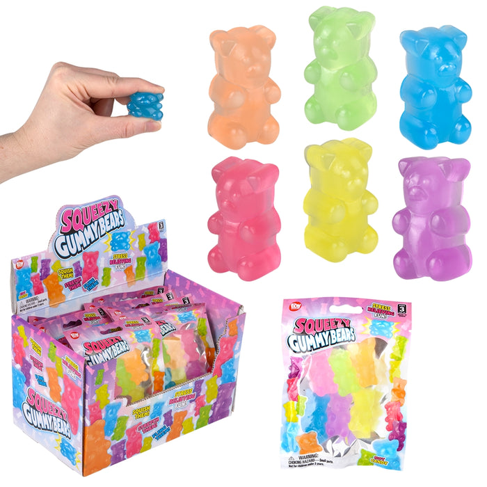 Colorful gummy bear toys with packaging and a hand holding one toy.