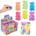 Colorful gummy bear toys with packaging and a hand holding one toy.