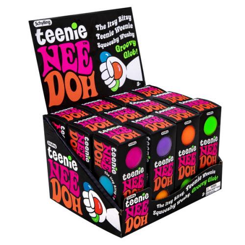 Display of Teenie Nee Doh boxes with colorful packaging on a white background