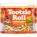 A bag of Tootsie Roll Harvest Mix candy, featuring an orange and white package with autumn leaf graphics, a cartoon owl, and illustrations of candy corn, a pumpkin, and a caramel apple. The package contains 11.
