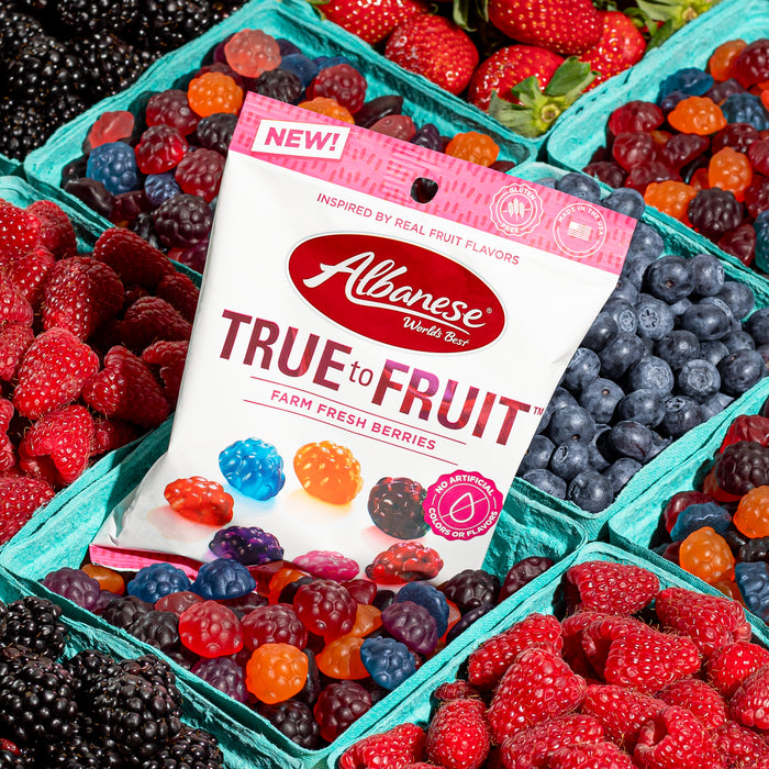 Albanese True to Fruit packaging with a background of fresh berries