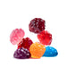 Colorful gummy candies shaped like berries on a white background