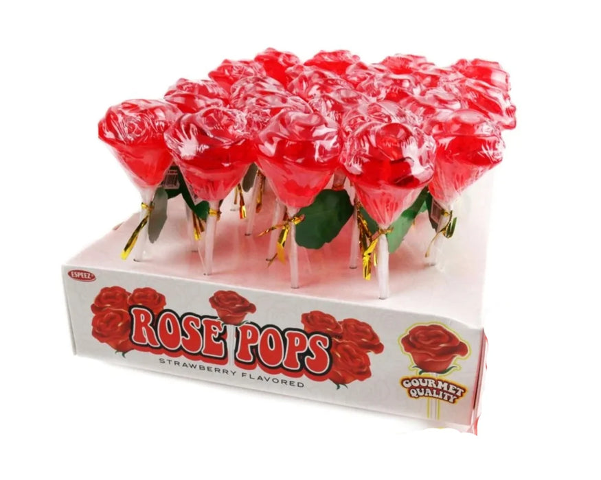 A box of strawberry-flavored 'Rose Pops' lollipops, showing several red rose-shaped lollipops in clear wrapping standing in a white display box with red rose graphics.