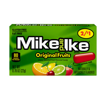 A box of Mike and Ike Original Fruits chewed fruit flavored candy, featuring a bright green background with the brand logo in white and black, a yellow 2/$1 badge, and illustrations of various fruits including an orange, lime, cherry, and strawberry.