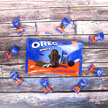 OREO Ghosts packaging with Halloween-themed Oreo cookies on a wooden surface