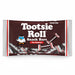 A package of Tootsie Roll Snack Bars in share size, featuring a dark brown label with white lettering, a small owl mascot, and wrapped chocolate bars visible along the bottom.