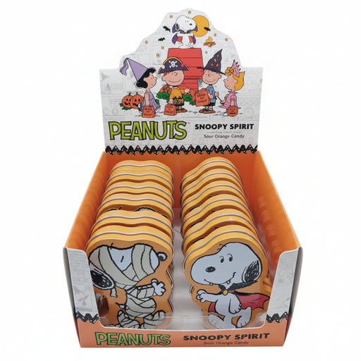 A retail display box filled with Peanuts Snoopy Spirit sour orange candy. The display features cartoon illustrations of Snoopy, Woodstock, and other Peanuts characters on the header card and front panel, with the text 'PEANUTS SNOOPY SPIRIT' clearly visible.