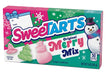 A box of SweetTarts Original Merry Mix candy, featuring pink and blue packaging with illustrations of a snowman, candy shapes, and holiday designs.