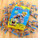 Krabby Patties gummy candy package with scattered pieces on a wooden surface
