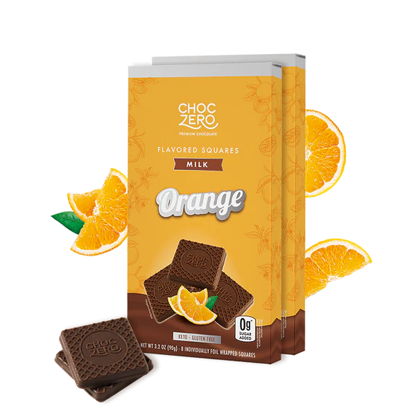 Box of ChocZero Orange flavored squares with orange slices on a white background