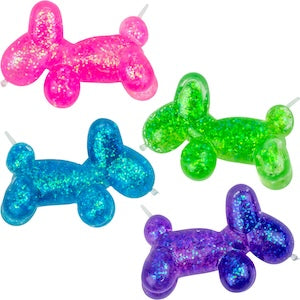Four colorful glittery balloon dog-shaped candles on a white background