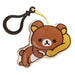 Keychain with a cartoon bear holding a banana on a white background